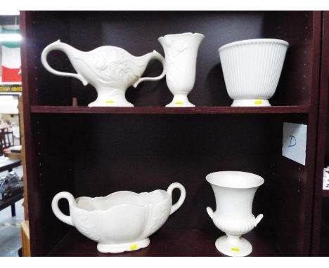 A collection of cream floral ceramic vases and display bowls by Wedgwood, and Spode (5)