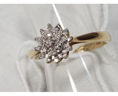A lady's 9ct gold diamond cluster ring, 1.6 grams