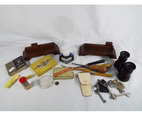 A good mixed lot of vintage collectables to include wooden photo frames, a collection of rug making tools, vintage tins, a sm