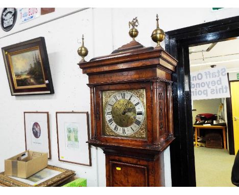 A good, burr walnut cased three-train Westminster-chiming longcase clock, made in the early 1900's in the style of a late 17t
