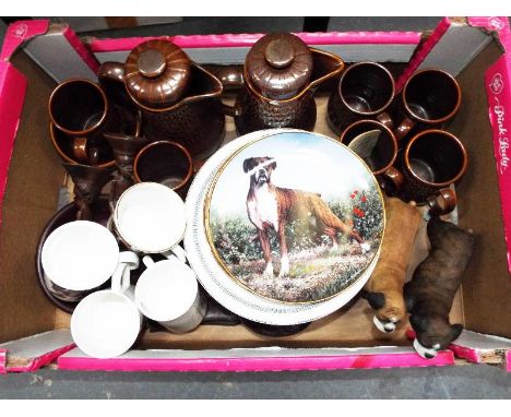 A part Wedgwood stoneware coffee service, a large collection of boxer dog related collector plates, two resin figurines of a 