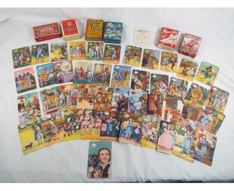 A collection of six vintage playing card games to include a rare set of The Wizard of Oz , Mirth and Magic, card games copyri