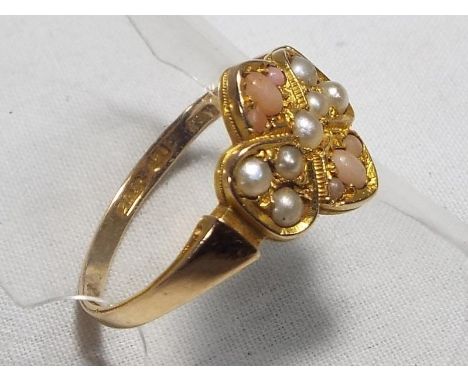 A lady's 15ct gold ring set with seed pearl and coral, size S, approx weight 2.39 grams Est £30 - £50