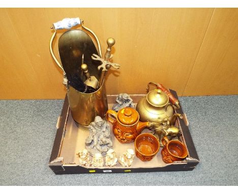 A good mixed lot to include a collection of brassware, a ceramic teapot with sugar bowl and creamer, and ornamental figures