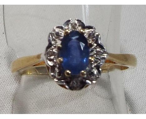 A lady's  9 carat gold hallmarked sapphire and diamond cluster ring, size M and a half, boxed, approximate weight 2.5 grams