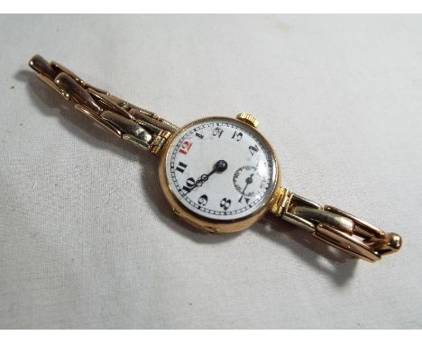 A 9 carat gold cased wristwatch with ceramic dial with expandable bracelet marked Premo 9ct, Estimate £120 - £150
