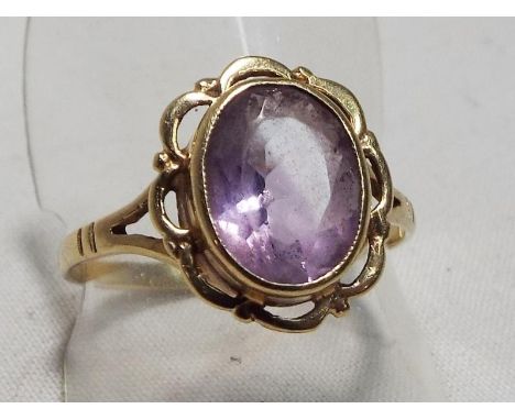 A lady's 9 carat gold hallmarked amethyst solitaire ring, size P, boxed, approximate weight 2.4 grams