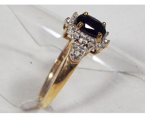 A lady's 9 carat gold black sapphire and diamond cluster ring, approx weight 1.4 gm, size O - Est £25 - £35
