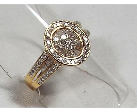A lady's 9 carat gold ring set with 50 pt 1/2 ct bagette and round diamonds, size M + 1/2, approx weight 3.4 gm, unused in pr