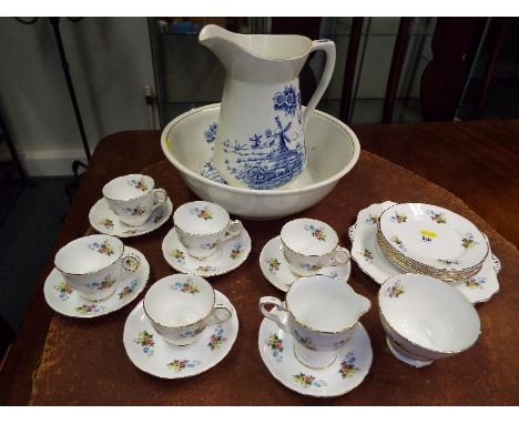 A Royal Stafford ceramic tableware to include cups saucers side plates and creamer (20) and ceramic wash set decorated in the