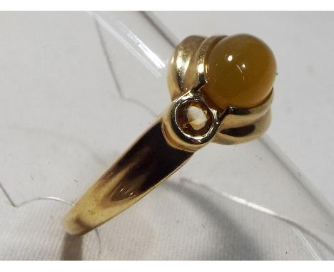 A lady's hallmarked 9 carat gold amber and citrine ring, size P, boxed, approximate weight 2.6 grams