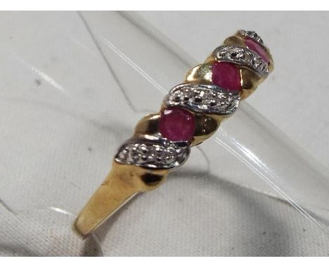 A lady's 9 carat gold hallmarked ruby and diamond ring, size L, boxed, approximate weight 1.7 grams