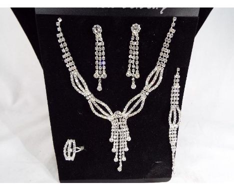 A lady's evening statement necklace, bracelet, ring and earring set, unused - Est £10 - £15