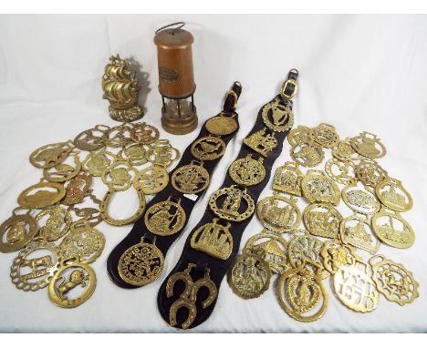 A good collection of horse brasses and a miners safety lamp marked Ferndale Coal and Mining Co