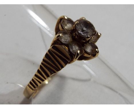 A lady's 9ct gold cluster ring size 'M', approximate weight 1.75 grams  Est £30 - £50