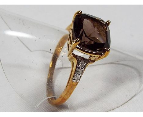 A lady's 9 carat gold diamond set smokey quartz ring, approx weight 2.4 gm, size K + 1/2  - Est £30 - £45
