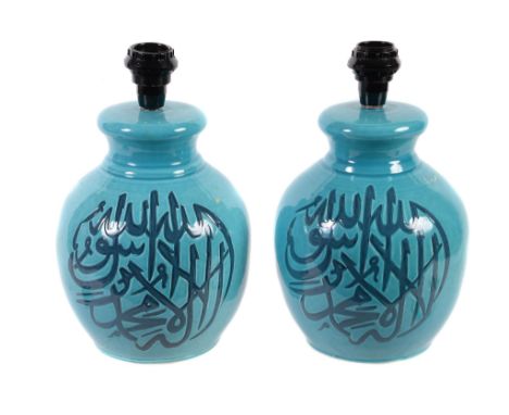  A pair of blue glazed ceramic table lamps,   loosely in Iznic taste, modern, each with calligraphic script the bulbous body,