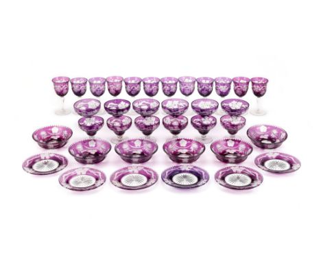  A Czech engraved and amethyst flashed glass part table service,   comprising: twelve various wine glasses; six champagne cup