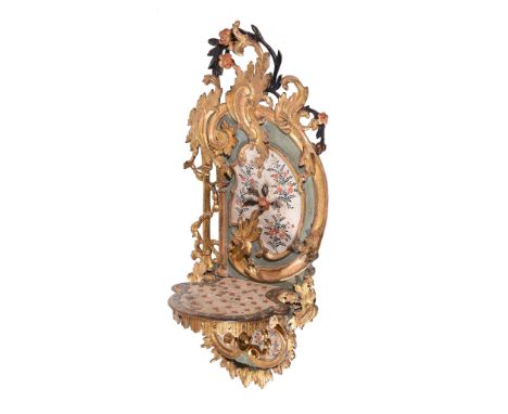  A Louis XV carved, painted and parcel gilt wood wall bracket,   circa 1770 and later redecorated overall, the cartouche shap