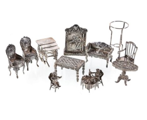  A collection of silver and silver coloured miniature furniture,   including: two cherubs sat eating at a table, import mark 