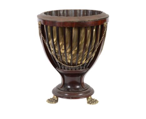  A late Victorian mahogany jardiniÃ¨re  , circa 1890, bearing  enamel label for James Shoolbread  &  Co. Tottenham House, Tot