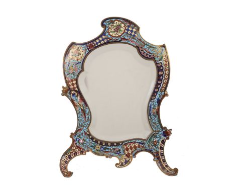  A French brass and champleve enamel dressing table mirror,   late 19th century, of cartouche outline, the frame decorated wi