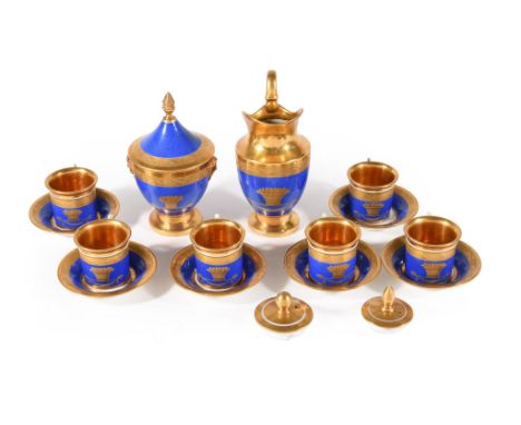  A Paris porcelain blue ground and gilt part coffee service,   circa 1830, comprising: a milk jug; a sucrier and cover; two a