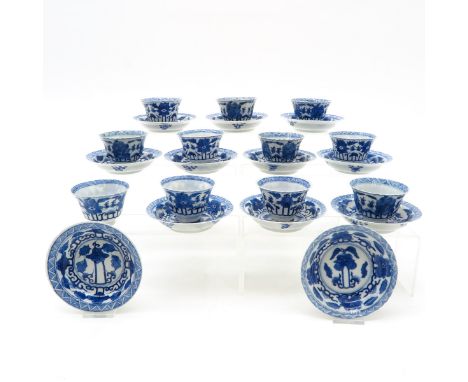 Saucers are 13 cm. in diameter, marked with double ring and 4 characters, chip and hairline.