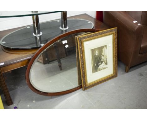 LARGE OVAL BEVELLED EDGE WALL MIRROR AND A WELL CARVED EDWARDIAN FRAME WITH PORTRAIT PHOTOGRAPH 