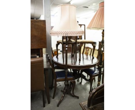 REGENCY STYLE MAHOGANY STANDARD LAMP ON SWEPT TRIPOD SUPPORTS, TERMINATING IN BALL FEET AND THE PINK SILK BOBBLE FRINGED SHAD
