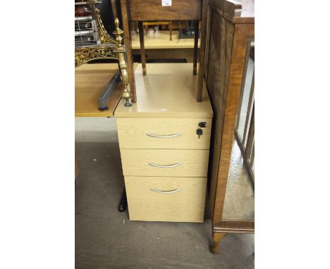 A SMALL LIGHT OAK TABLE DESK, on grey metal cantilever supprots, 4' x 2'8", AND THE MATCHING PEDESTAL OF THREE DRAWERS WITH M