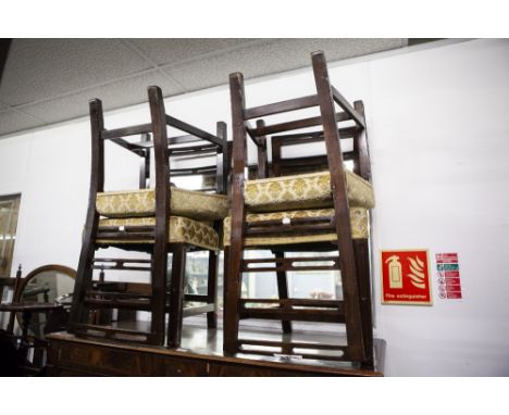A SET OF SIX MAHOGANY DINING CHAIRS OF GEORGIAN STYLE, WITH FOUR PIERCED LADDER RAILS TO THE BACK, INCLUDING A PAIR OF CARVER
