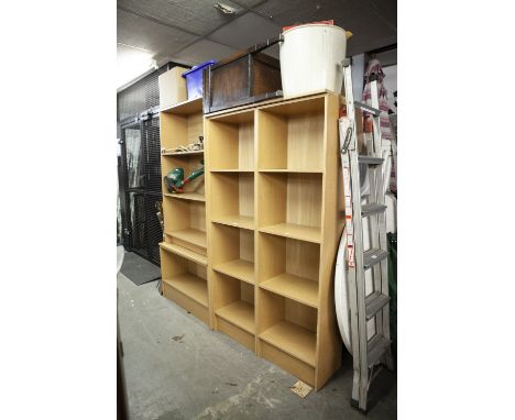A TWO DIVISION LIGHT FINISH OPEN BOOKCASE OF FOUR TIERS AND A SIMILAR BUT TALLER OPEN BOOKCASE 