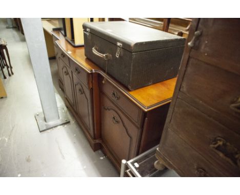 A MAHOGANY SIDEBOARD, WITH THREE DRAWERS, OVER THREE MOULDED PANEL DOORS, THE BRASS DROP HANDLES, ON BRACKET FEET, 3'10" 
