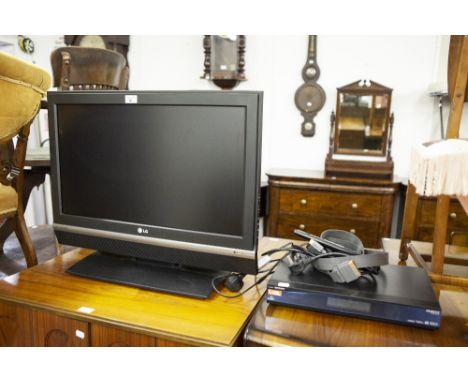 A LG. 27" FLAT SCREEN TV WITH REMOTE CONTROL AND A HUMAX FREESAT PLUS (MODEL FOXSAT-HDR) (2) 