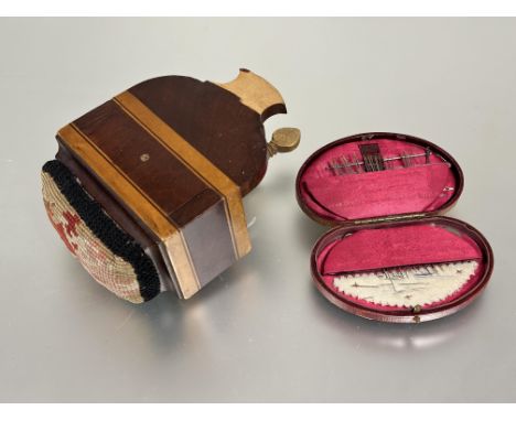 A Edwardian John James &amp; Sons Reddich Moroccan faded red leather shaped sewing case fitted with red satin lined sections 