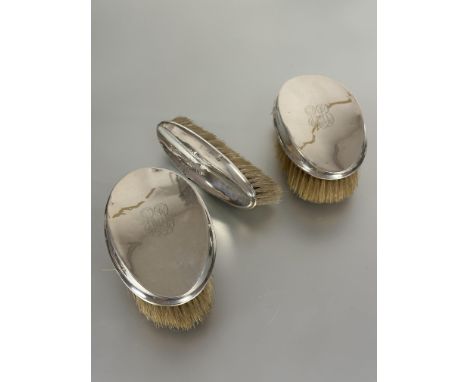 A set of three Edwardian Birmingham silver backed Gents hair and clothes brush with engraved with initials R A B L x 13cm x W