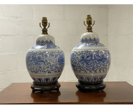 A pair of Chinese style blue and white ceramic ginger jar form lamp bases. H43cm.&nbsp;