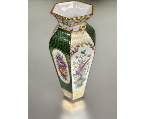 A early 20thc Dresden hexagonal tapered vase with gilt lip to top and alternation oval floral hand painted enamel panels with