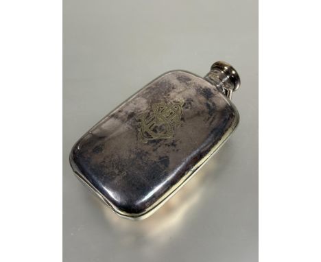 A Edwardian Epns hip flask of rounded rectangular form with screw down locking hinged cap engraved with initials S P B and en