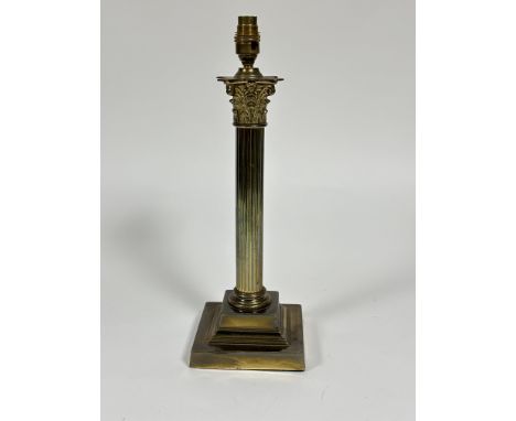 A Edwardian cast brass Corinthian fluted column oil lamp base raised on square stepped base converted to electricity H x&nbsp