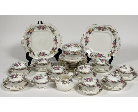 A Hammersley &amp; Co part tea service decorated with Dresden style pattern with gilt edging comprising, a milk jug (h-9cm), 