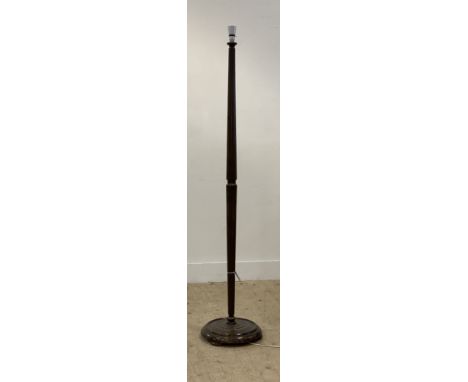 A 1930's stained beech standard lamp, the turned and fluted column on a circular base. H161cm.&nbsp;