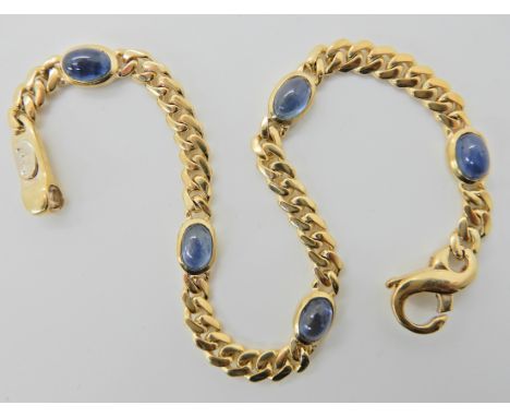 A 9CT GOLD ITALIAN MADE SAPPHIRE BRACELET the five sapphire cabouchons are approx 6mm x 4mm x 3.2mm, set along a 9ct yellow g