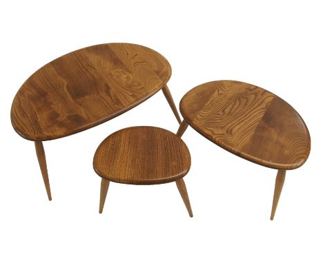 A NEST OF THREE LIGHT ELM ERCOL PEBBLE TABLES the largest 40cm high x 65cm wide x 44cm deep Condition Report: No label, signs
