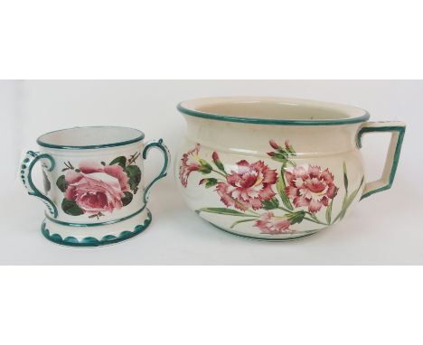 A WEMYSS WARE CHAMBER POT painted with carnations, impressed mark R. H &amp; S, 22cm diameter, together with a tyg painted wi