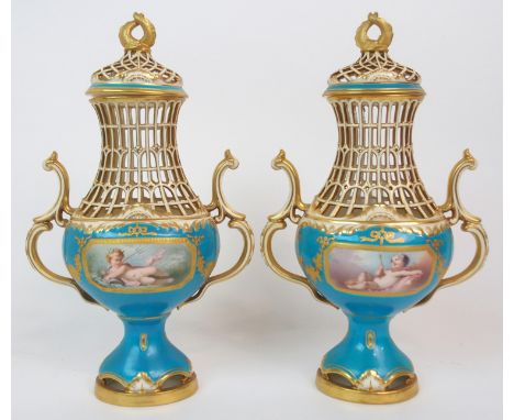 A PAIR OF MINTON POT POURRI VASES AND COVERS of baluster shape and in Sevres style, with two scroll handles, pierced neck and