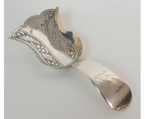 A SILVER CADDY SPOON by John Betteridge, Birmingham 1820, of shovel shape with engraved decoration, the terminal bearing a cr