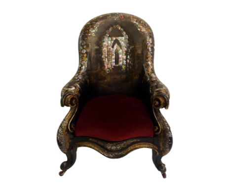 A MID-VICTORIAN BLACK LACQUERED PAPIER MACHE ARMCHAIR the back painted and inlaid with mother of pearl with figures within Ti