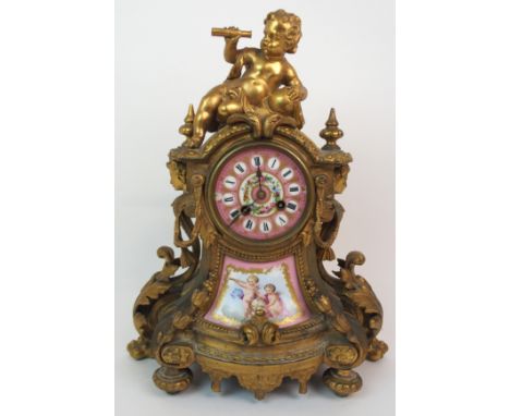 A LATE 19TH CENTURY FRENCH ORMOLU AND PORCELAIN MOUNTED MANTEL CLOCK the pink dial with Roman numerals and painted flowers ab